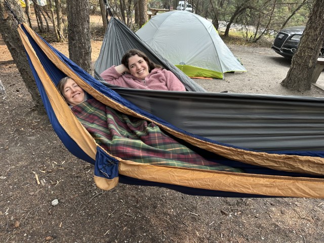 Krista Francis laying in hammock at campsite